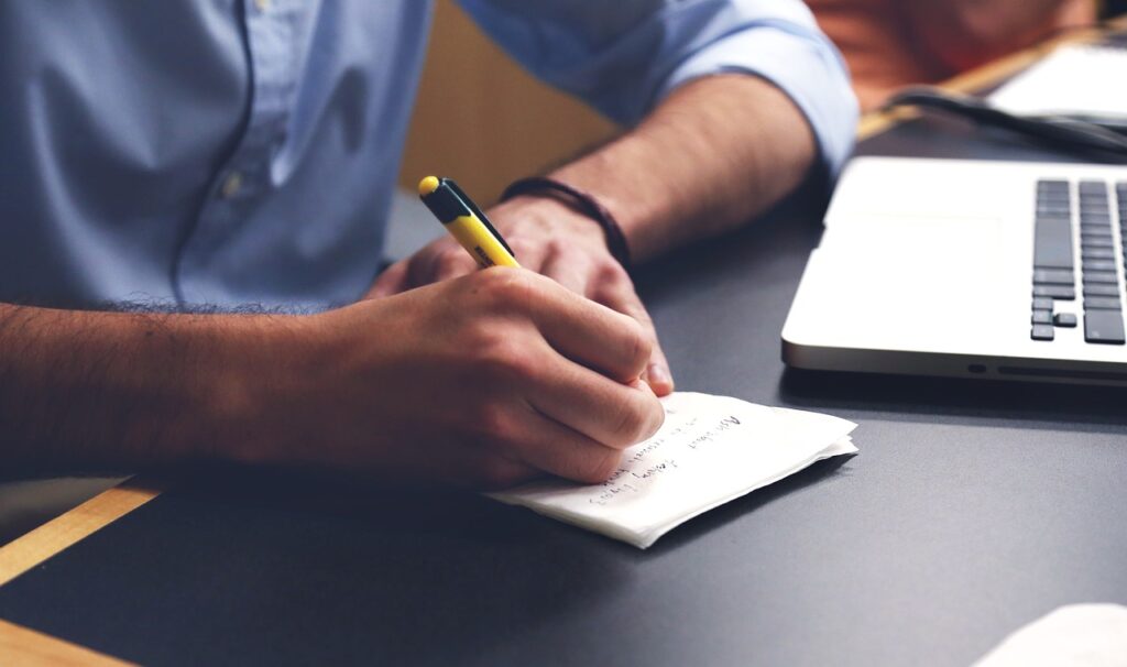 Man writing in journal